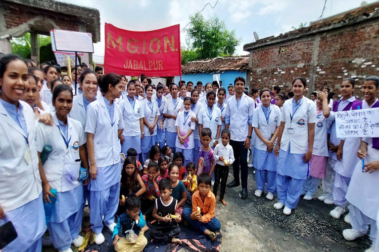 Photograph of Students of Mahatma Gandhi Institute of Nursing Jabalpur M.P. taken during a medical camp.